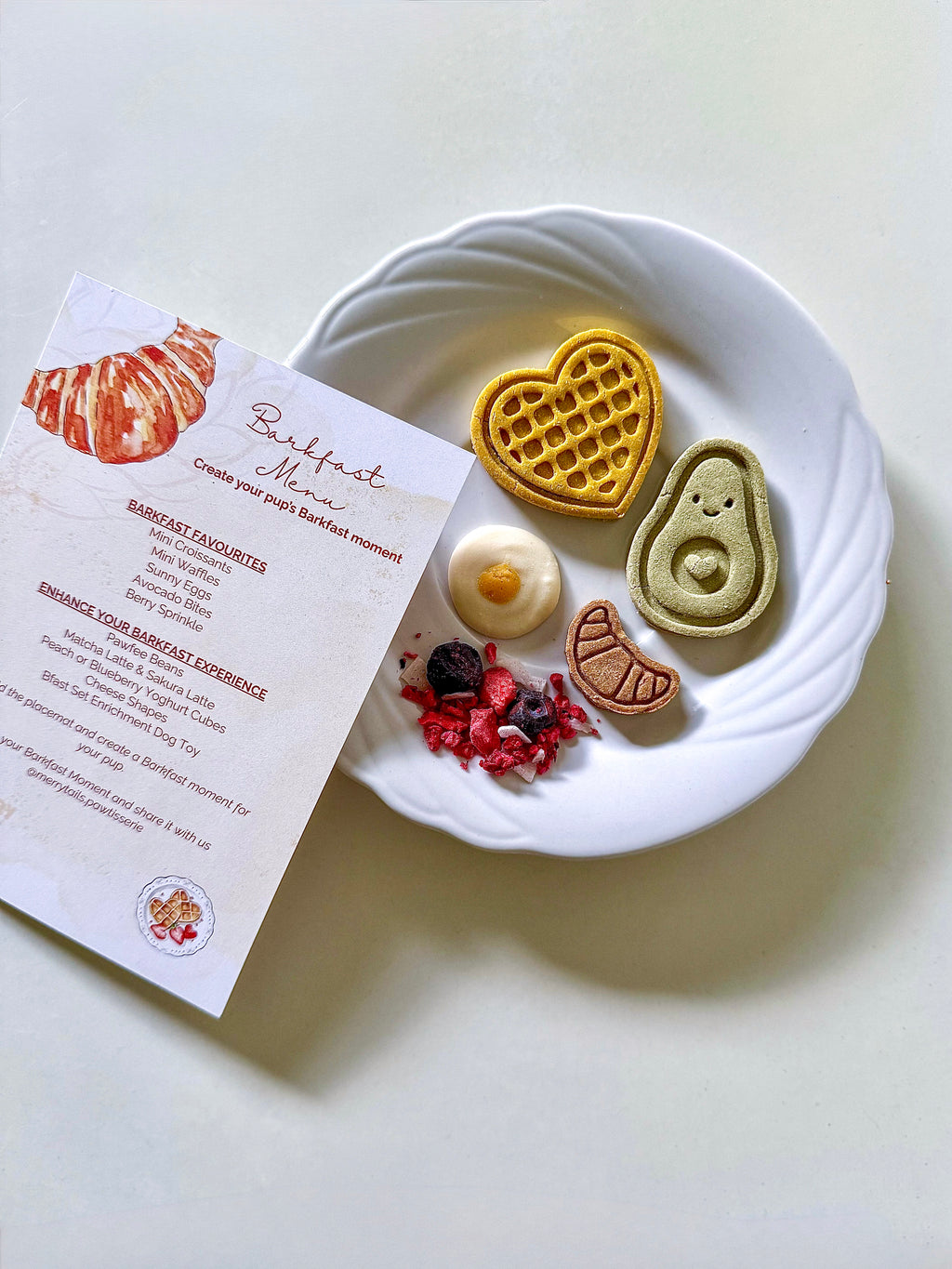 Barkfast Moment café-inspired breakfast experience featuring handmade dog biscuits, Berry Sprinkle and the Barkfast menu card.