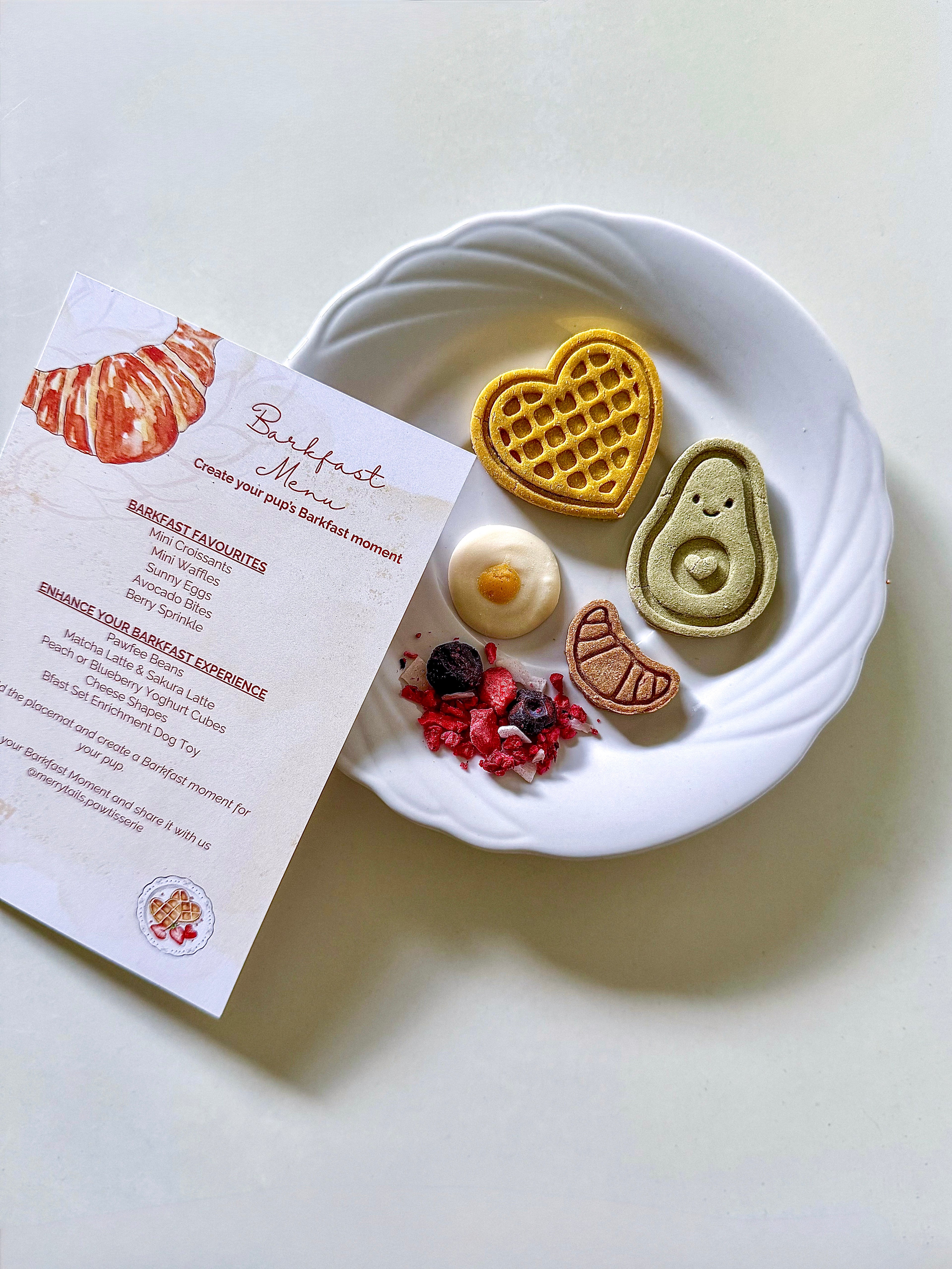 Barkfast Moment café-inspired breakfast experience featuring handmade dog biscuits, Berry Sprinkle and the Barkfast menu card.