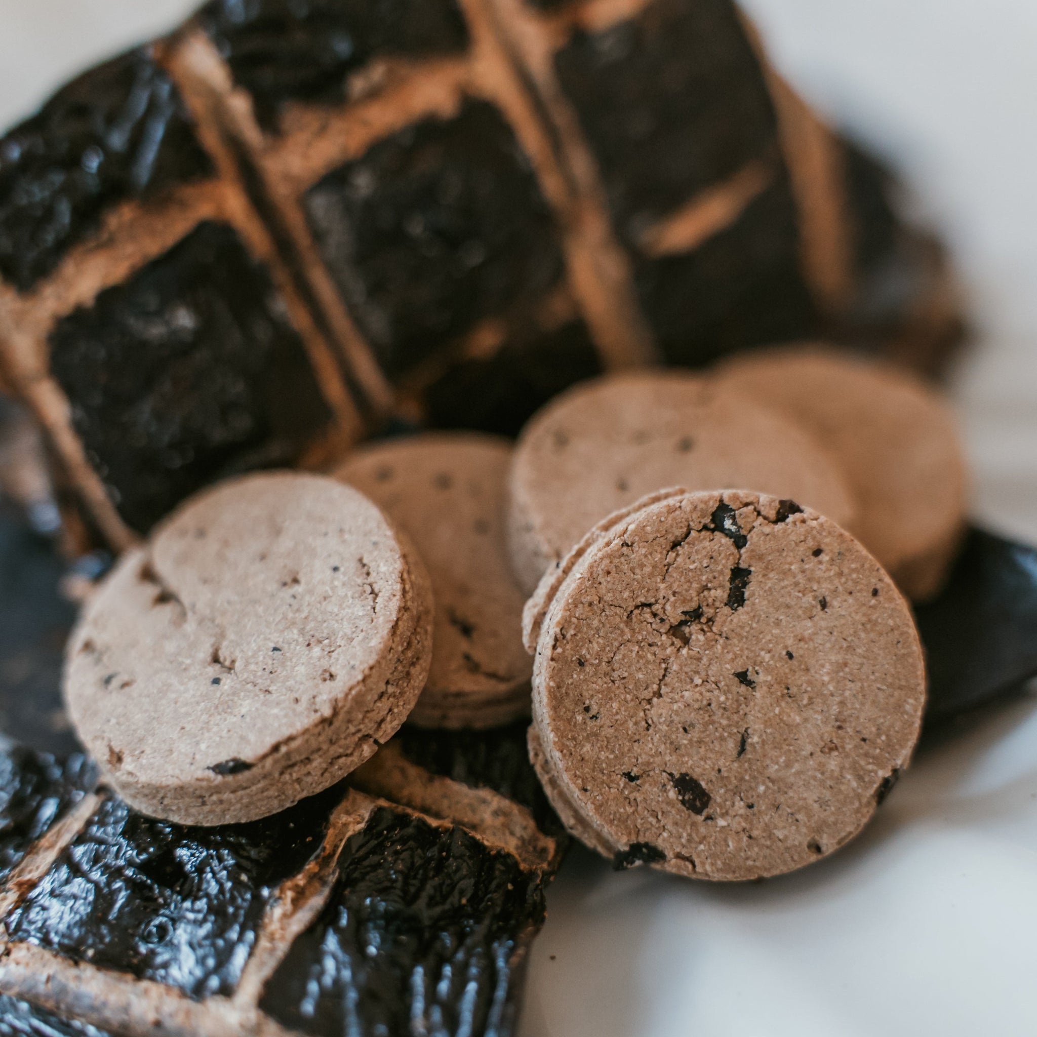Stacked beef liver dog cookies highlighting thickness and crunchy texture