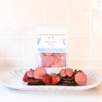 Berry Beet Bites dog treats packaging displayed with strawberries, beetroots and biscuits