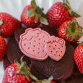 Berry Beet Bites dog biscuits with fresh strawberries and beet slices