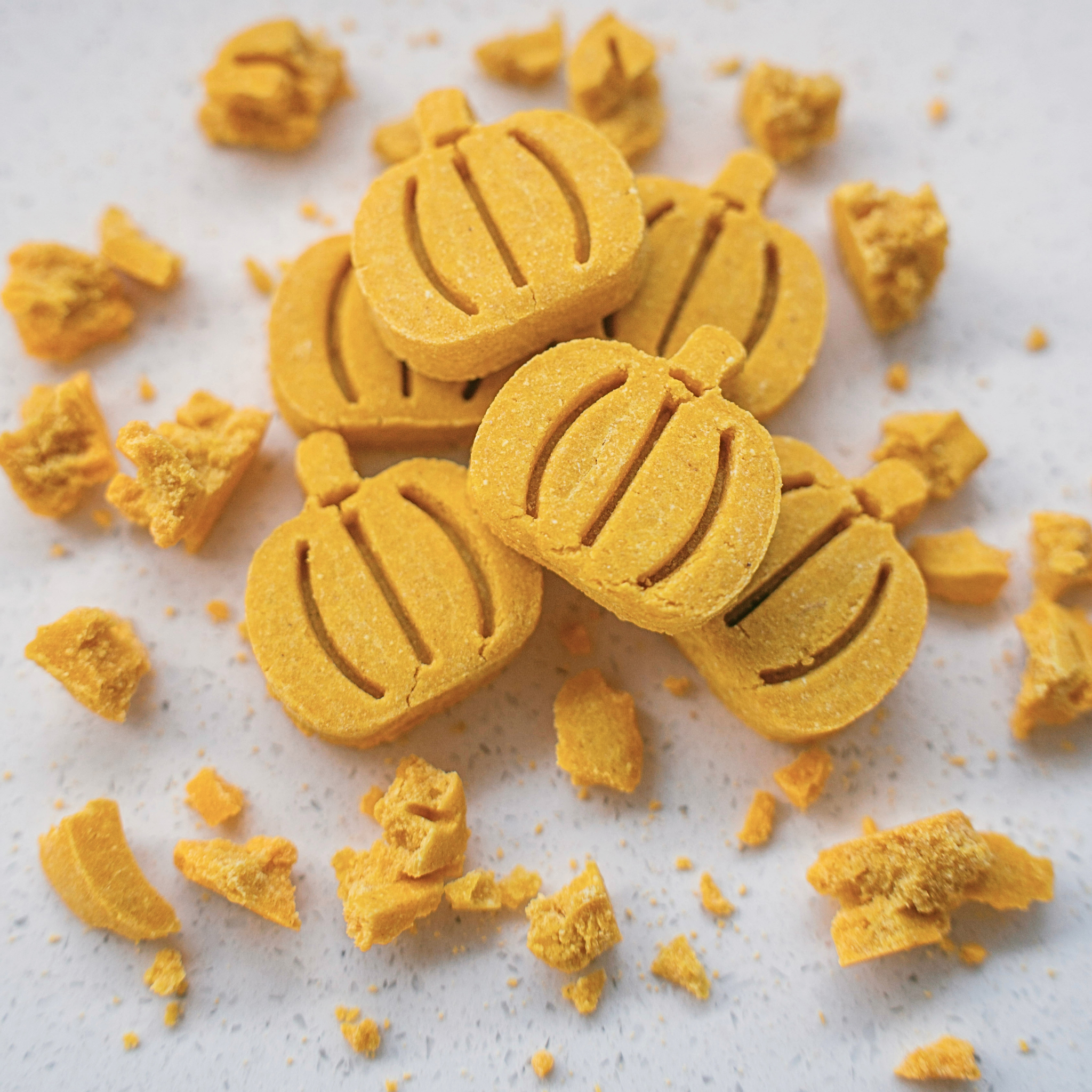 Close up texture of handmade pumpkin dog biscuits with human-grade ingredients