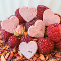 Heart-shaped raspberry and rose dog biscuits by Merry Tails Pawtisserie