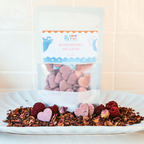 All natural handmade Roseberry Hearts raspberry and rose dog treats in packaging